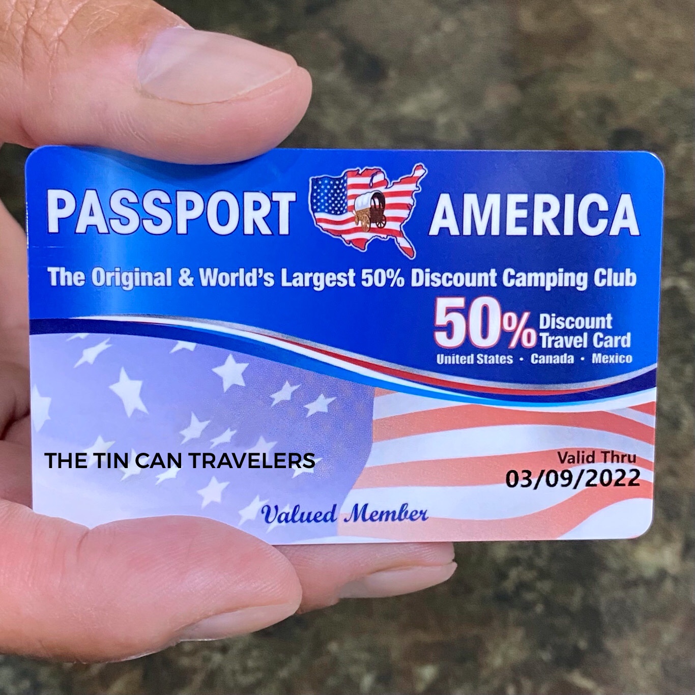 hand holding a Passport America discount card