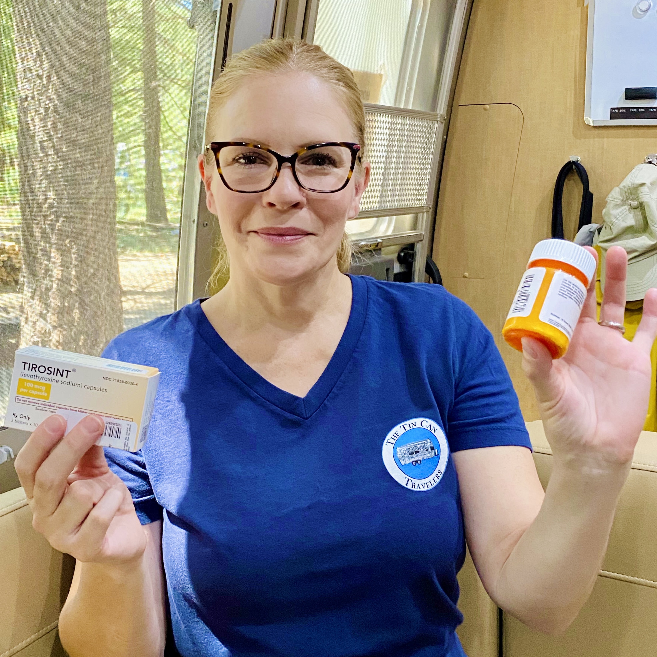 Rebecca holding her prescription medication she received in the mail while full-time RVing